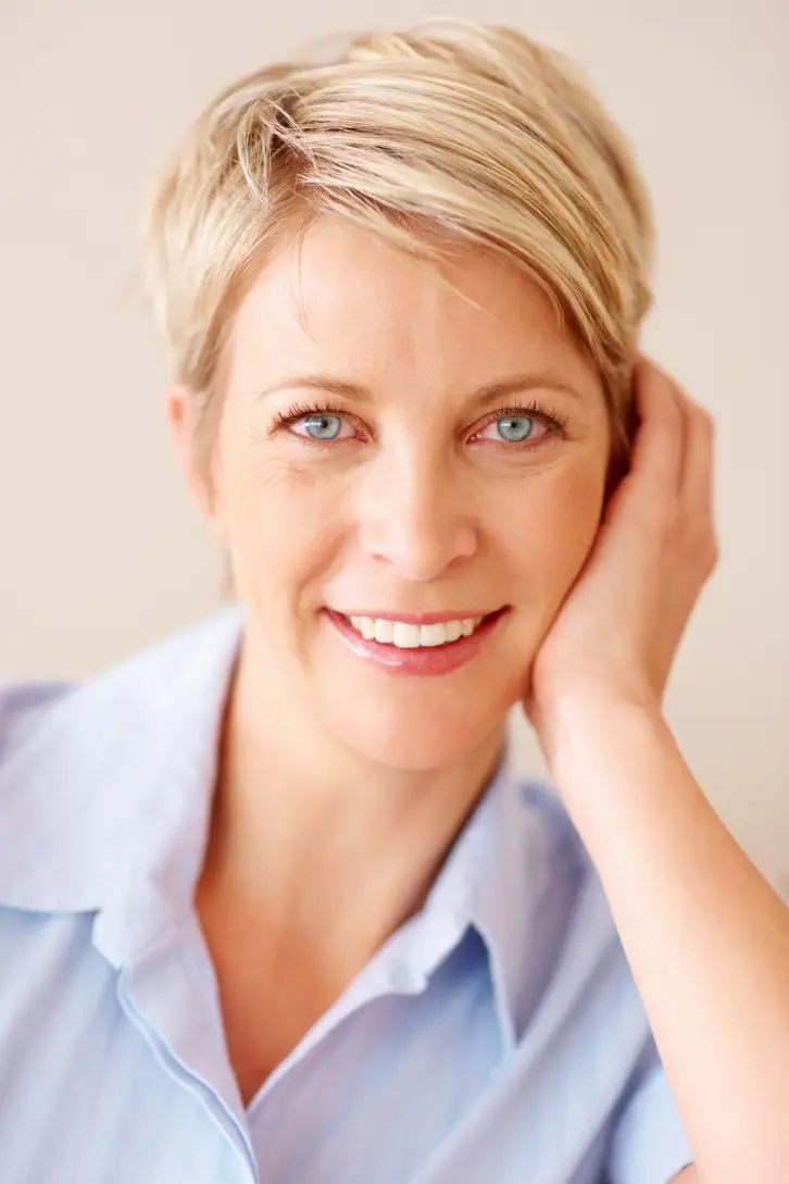 Blonde woman with smooth, youthful facial features after facial rejuvenation treatment