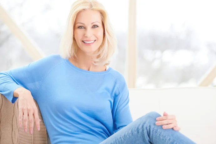 Blonde woman with smooth, youthful facial features after facial rejuvenation treatment