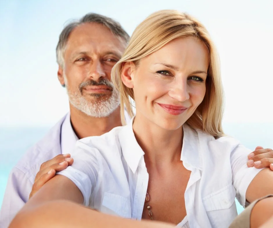 male vs female pattern baldness: happy couple with male showing signs of baldness