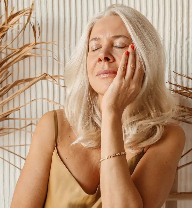 Mature woman enjoying smooth, refreshed skin after skin resurfacing treatment in Gulf Shores