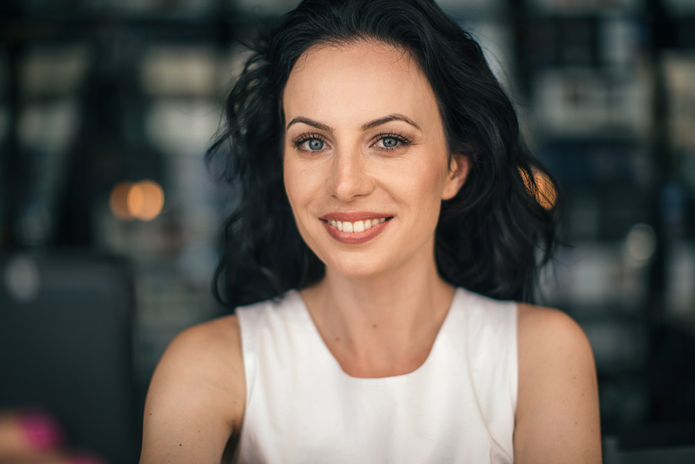 Skin rejuvenation: Smiling woman with smooth skin and a refreshed facial appearance